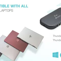 En mörkgrå dockningsstation med usb thunderbolt-portar, bredvid flera moderna laptops i olika färger.