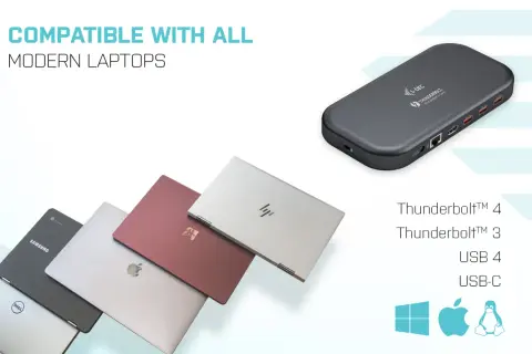 En mörkgrå dockningsstation med usb thunderbolt-portar, bredvid flera moderna laptops i olika färger.