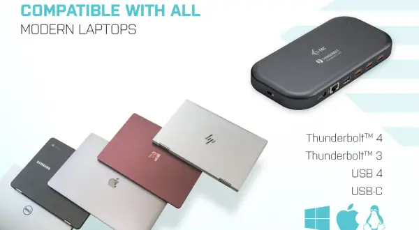 En mörkgrå dockningsstation med usb thunderbolt-portar, bredvid flera moderna laptops i olika färger.